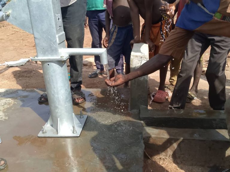 Handwashing with clean water at a new borehole