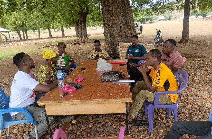 Savings group members meeting with RACED Ghana facilitators