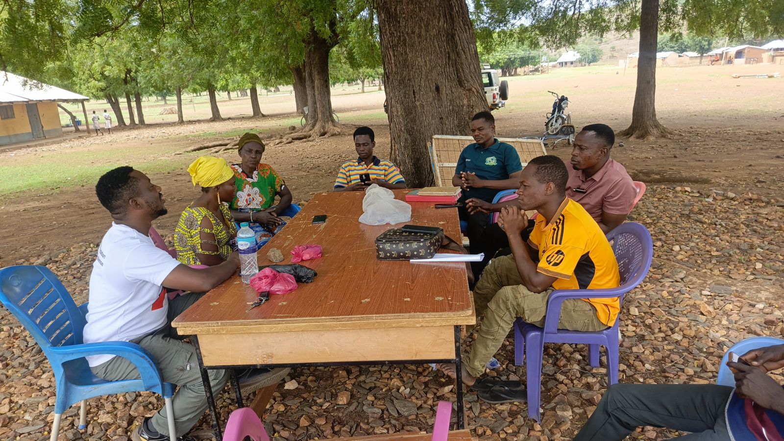 Savings group members meeting with RACED Ghana facilitators